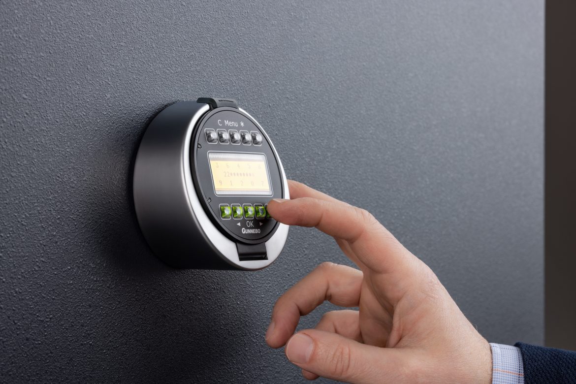 Person entering code into lock